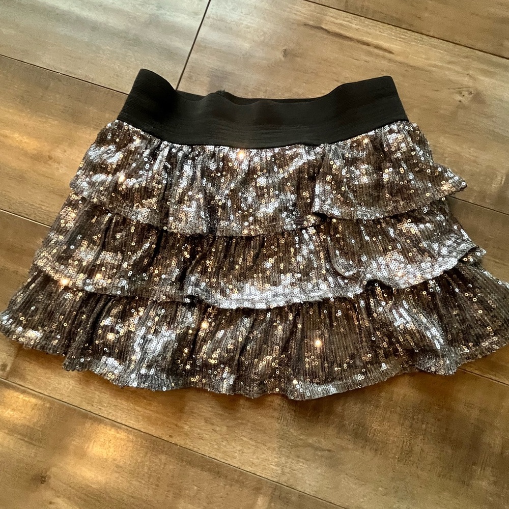 Girls silver sequined ruffle skirt. Size 12